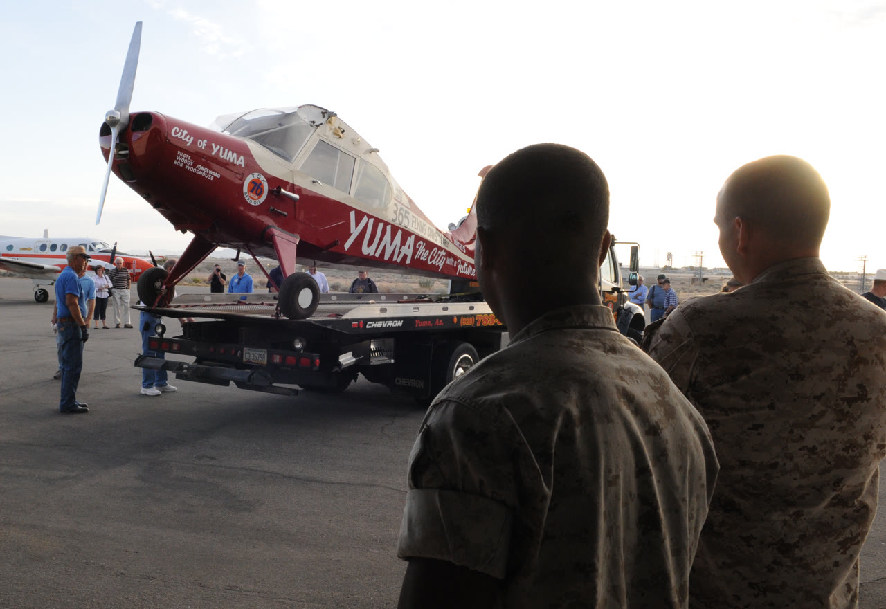 The City of Yuma Aeronca Sedan being moved into a hangar during its 60th-anniversary commemoration in Yuma, Arizona.