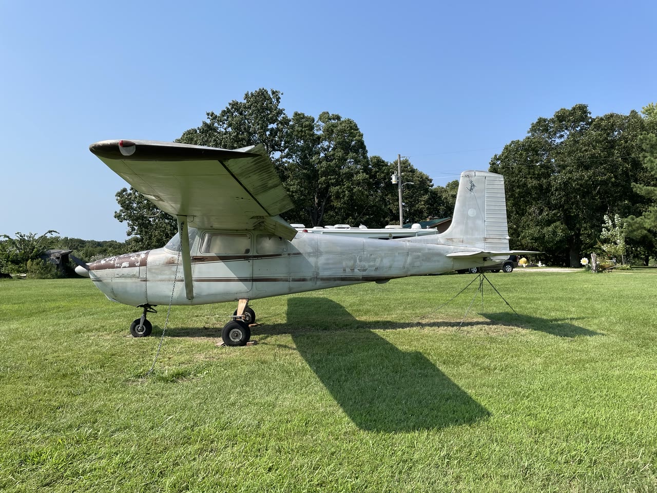 Left-side profile of N8777B after exterior cleaning, with its faded original finish and registration visible.